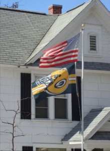 A Green Bay Packer flag flies upside-down on a late February afternoon in La Crosse.