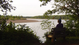 Obbie takes in the Chippewa River at a resting stop between Eau Claire and Durand, celebrating the fact that a nuclear power plant was not built there.